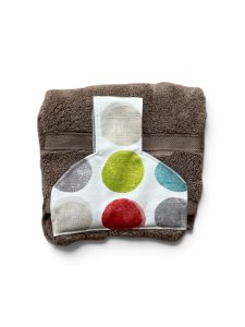 Hand towel to hang on an oven/kitchen or AGA rail. Fastened with a magnetic popper. Towel is mushroom coloured. Pattern placing on top varies.